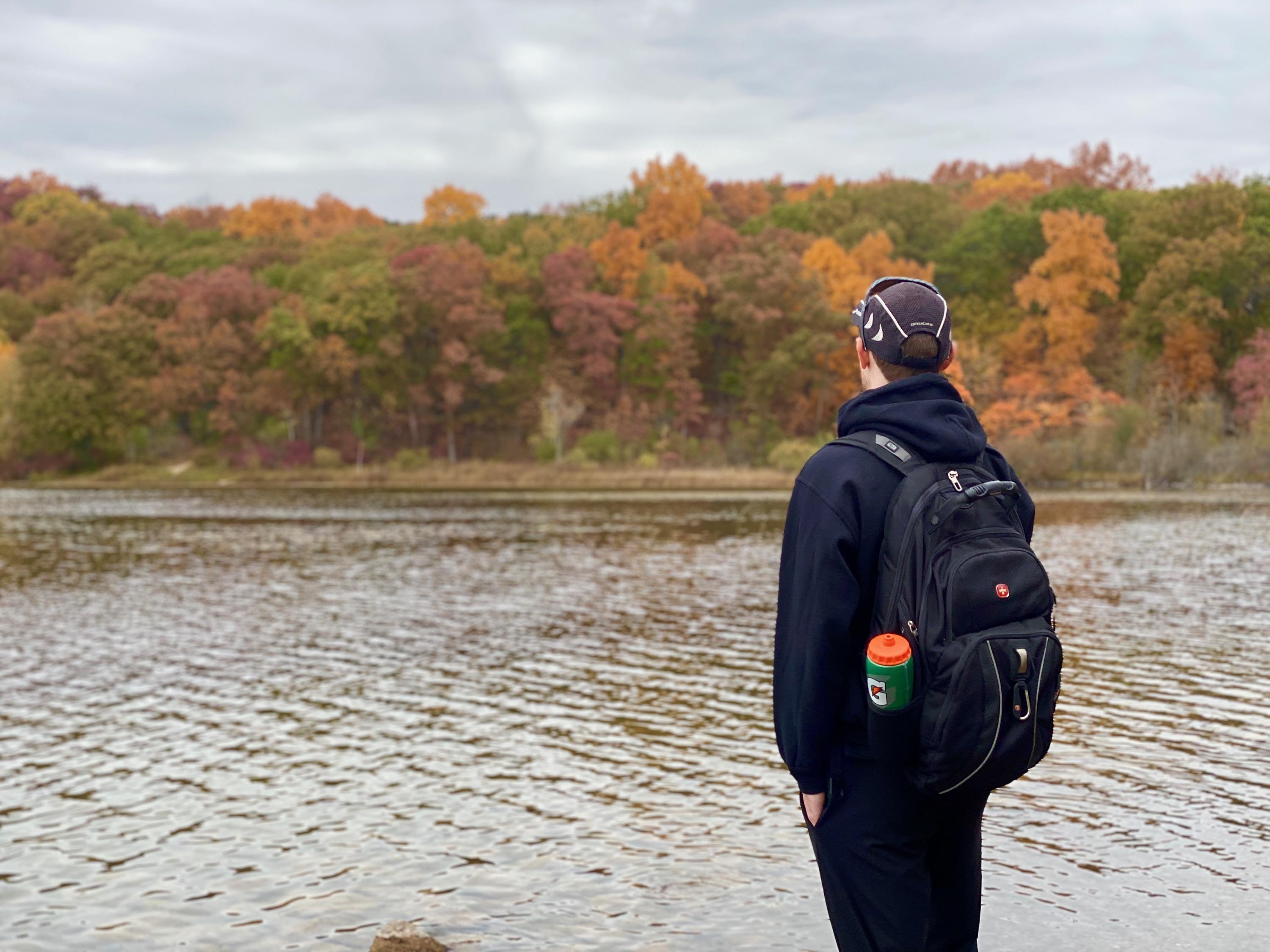 Photo of Dylan looking out at a lake